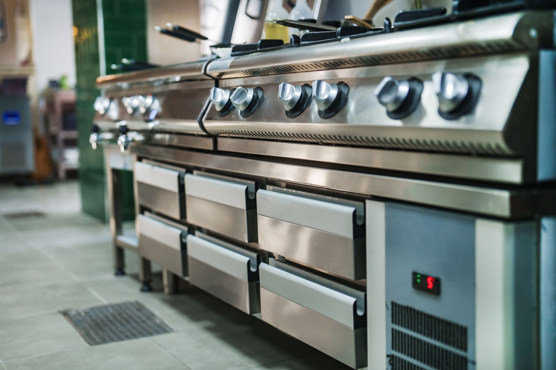 Close-up of the knobs on the restaurant stoves.